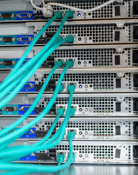 Man data center technician performing server maintenance Data center technician performing server maintenance.